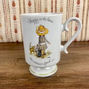 Holly Hobbie Pedestal Mug, Happy is the home that welcomes a friend